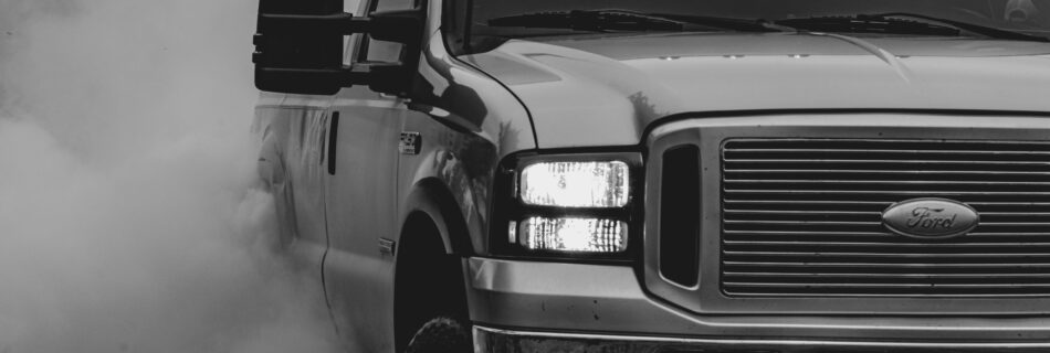 Diesel Truck Driving down a road